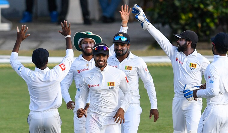 Sri Lanka players celebrate the dismissal of West Indies' Kieran Powell on day 2 of the Test | AFP