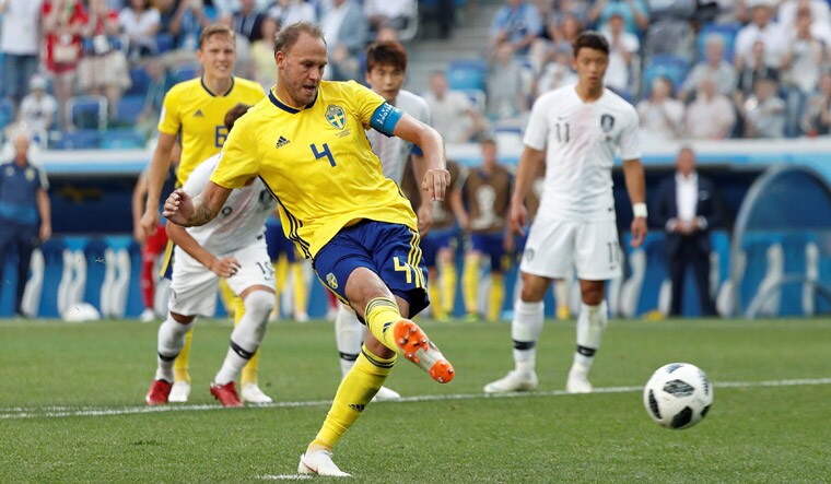 Sweden's Andreas Granqvist scores their first goal | Reuters