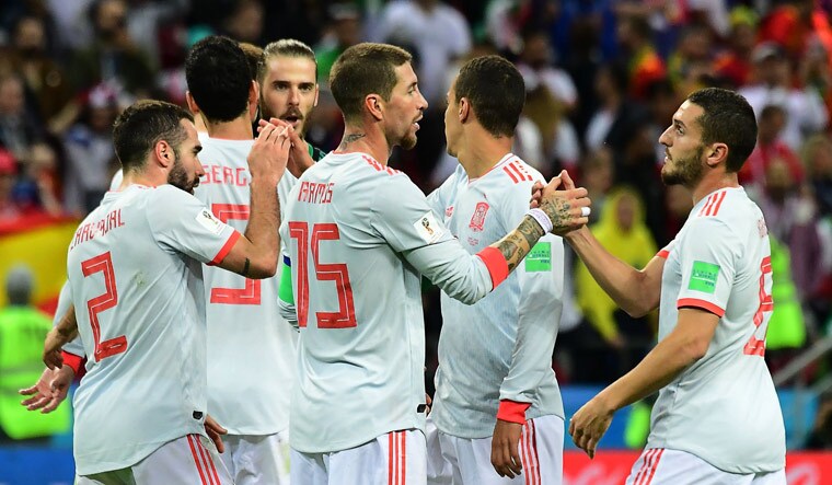 Spain's defender Sergio Ramos (centre) and teammates celebrate their victory over Iran | AFP