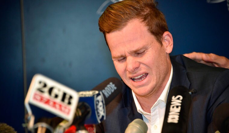 [FILE] Australian cricket player Steve Smith reacting at a press conference at the airport in Sydney on March 29 | AFP