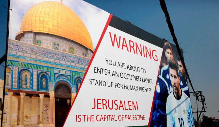 A poster erected in the West Bank town of Hebron denouncing the friendly football match between Argentina and Israel and calling Argentina's Lionel Messi to boycott the match | AFP