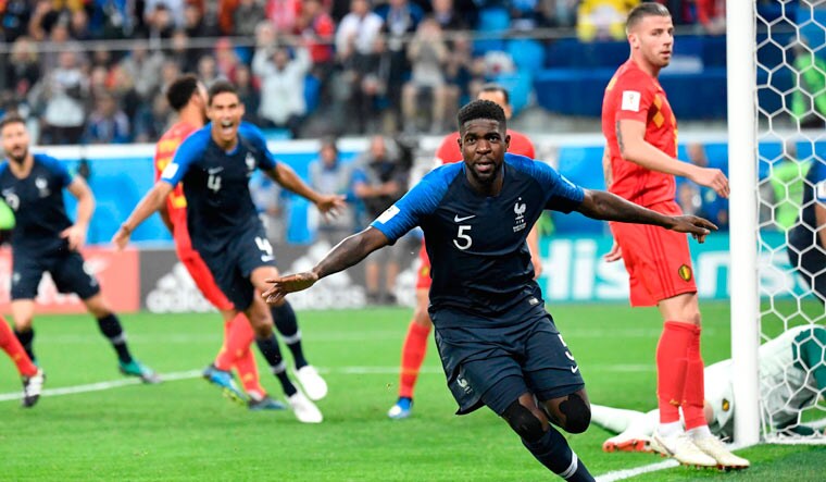 France's defender Samuel Umtiti celebrates after scoring the opening and the only goal of the semifinal match against Belgium at the St Petersburg Stadium | AFP