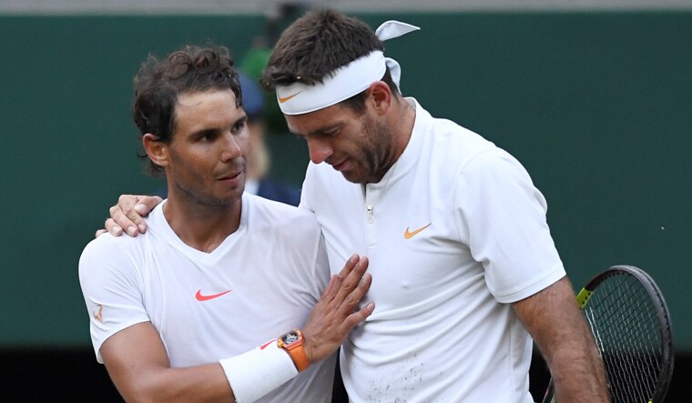 Spain's Rafael Nadal (left) embraces Argentina's Juan Martin Del Potro after winning his quarterfinal match | Reuters