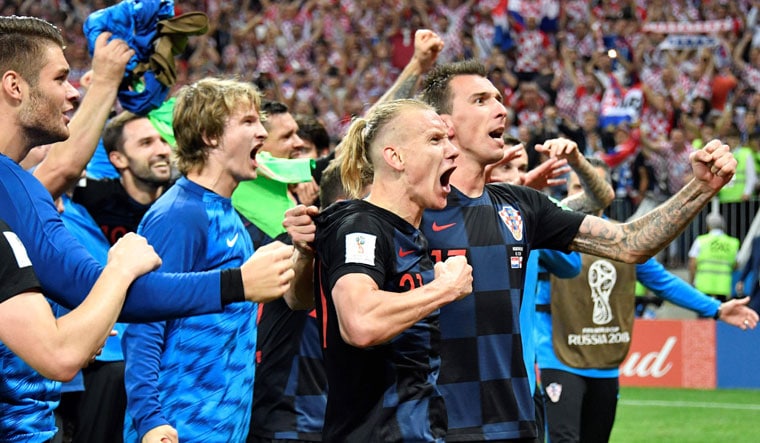 Croatian players celebrate their semifinal victory over England | AFP