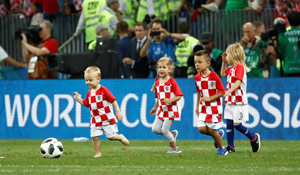 Croatian players' children play on the pitch | Reuters