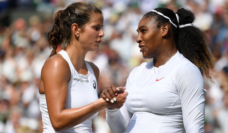 Serena Williams shakes hands with Julia Goerges after winning the semifinal match at the Wimbledon 2018 | Reuters