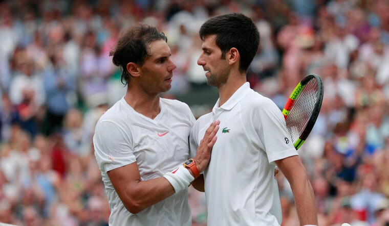 Novak Djokovic greets Rafael Nadal after defeating him in the men's singles semifinal at the Wimbledon Tennis Championships, in London | AP