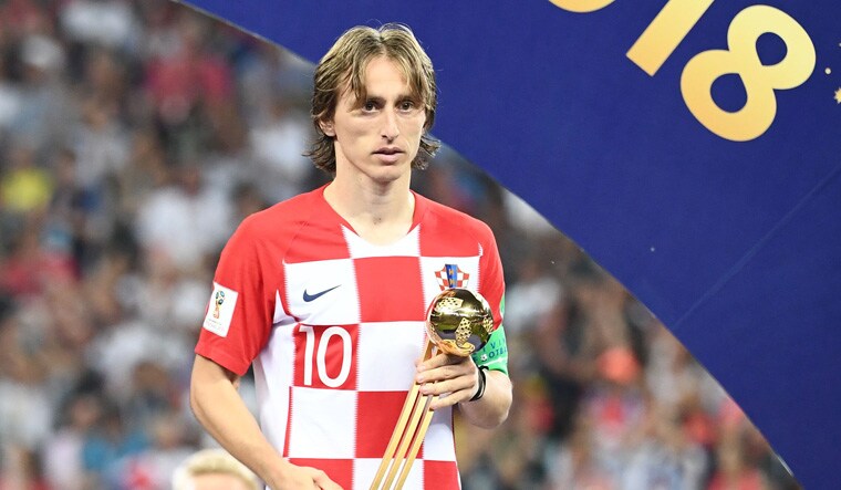 Luka Modric with the Golden Ball trophy | AFP