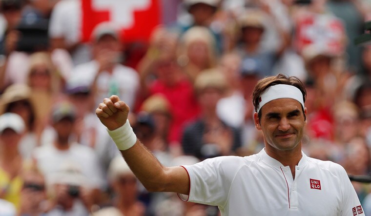 Switzerland's Roger Federer celebrates after winning the second round match against Slovakia's Lukas Lacko at the Wimbledon 2018 | Reuters