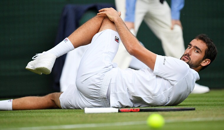 Croatia's Marin Cilic slips during his second round match against Argentina's Guido Pella at the Wimbledon 2018 | Reuters