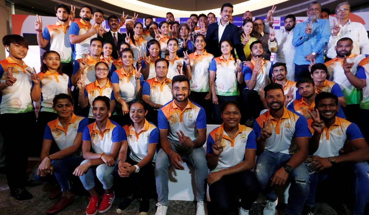 Members of the Indian contingent, participating in the 2018 Asian Games, pose for a picture during a send-off ceremony in New Delhi | Reuters