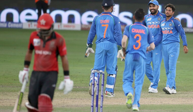 Kuldeep Yadav [right] celebrates with teammates the dismissal of Hong Kong's captain Anshuman Rath [left] during the one day international cricket match of Asia Cup between India and Hong Kong in Dubai | AP