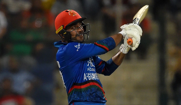 Afghanistan's Rashid Khan plays a shot during their Asia Cup match against Bangladesh | AFP
