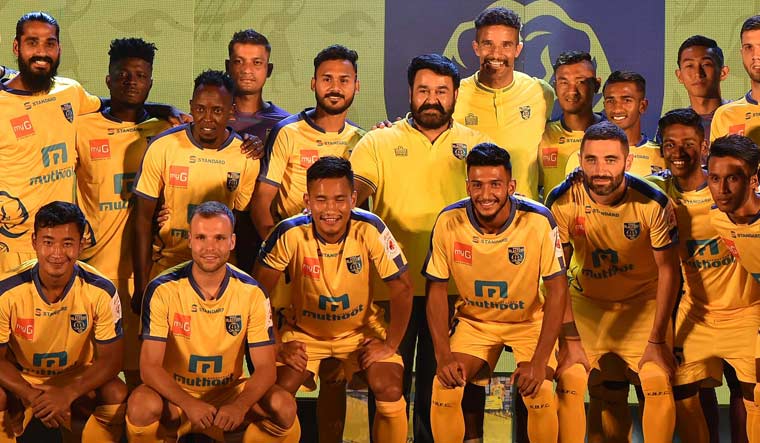 Mohanlal with the Kerala Blasters team after the unveiling of the kit for the ISL 2018-19 season, at Grand Hyatt in Kochi | Malayala Manorama