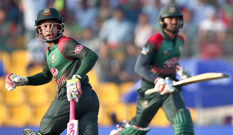 Mushfiqur Rahim (left) and teammate Mohammad Mithun run between the wickets during the Asia Cup match against Pakistan in Abu Dhabi | AP