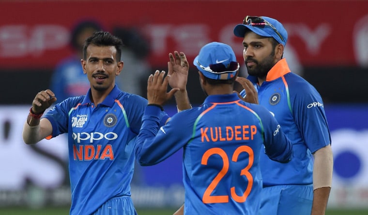 Yuzvendra Chahal (left) along with Jasprit Bumrah and Bhuvneshwar Kumar (not pictured) is expected to give firepower to India's bowling attack | AFP