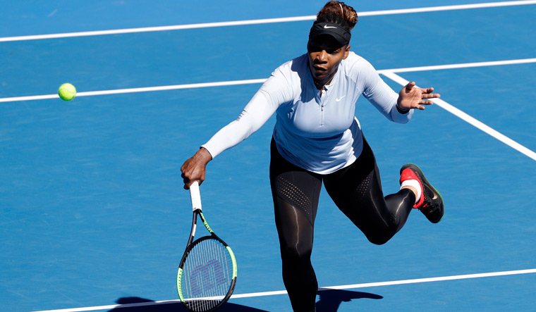 Serena Williams makes a backhand return during a practice session at the Australian Open tennis championships in Melbourne | AP
