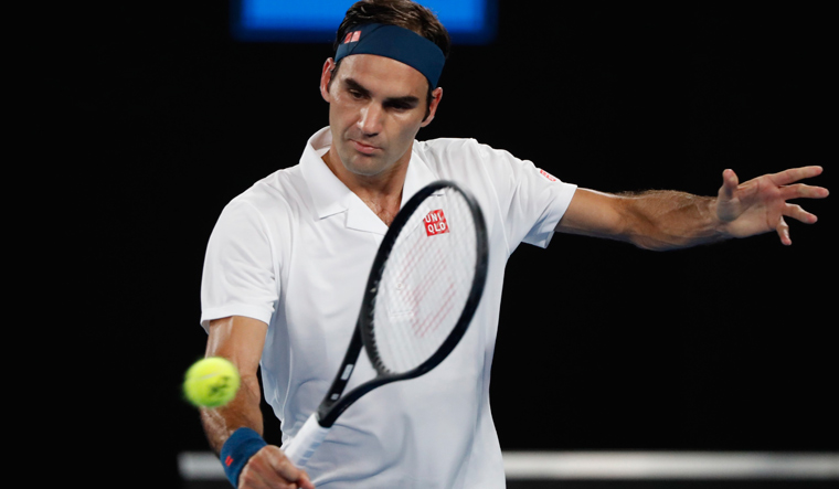 Australian Open: Federer marks 100th match with win over Fritz