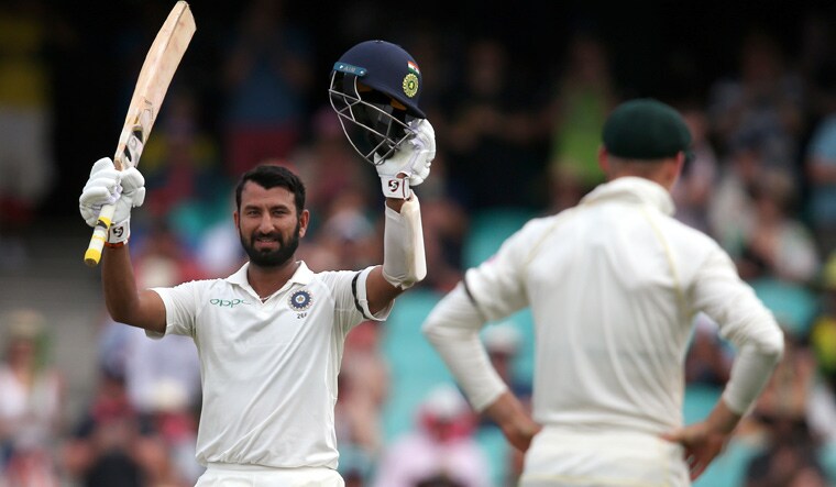 Cheteshwar Pujara celebrates making 100 runs against Australia during their cricket test match in Sydney on Thursday | AP