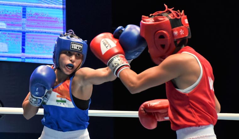 Manju Rani (left) lands a punch during a bout against Venezuela's Rojas Tayonis Cedeno at World Women's Boxing Championships, in Ulan-Ude, Russia | PTI