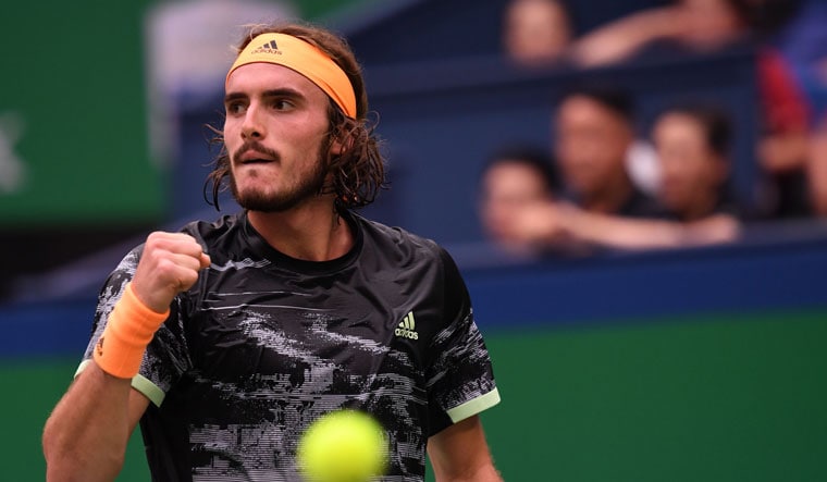Stefanos Tsitsipas reacts after a point against Novak Djokovic during their men's singles quarterfinal match at the Shanghai Masters | AFP