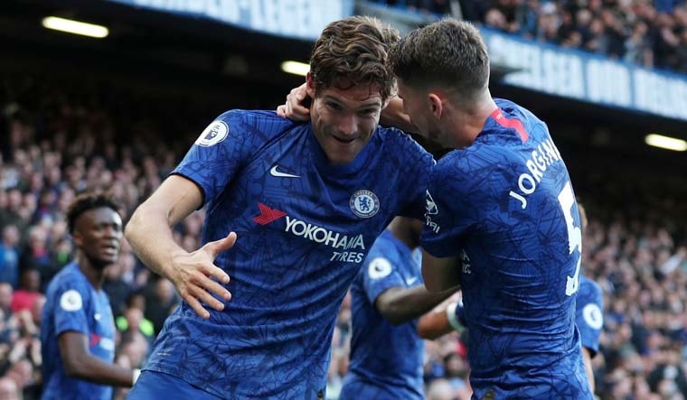 Chelsea's Marcos Alonso celebrates scoring their first goal with Jorginho | Reuters