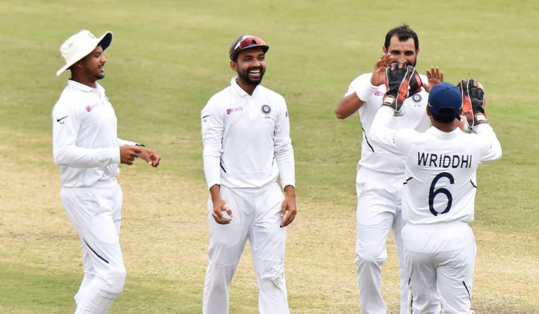 India's Mohammed Shami (second from right) celebrates with teammates the wicket of South Africa's Dane Piedt | PTI