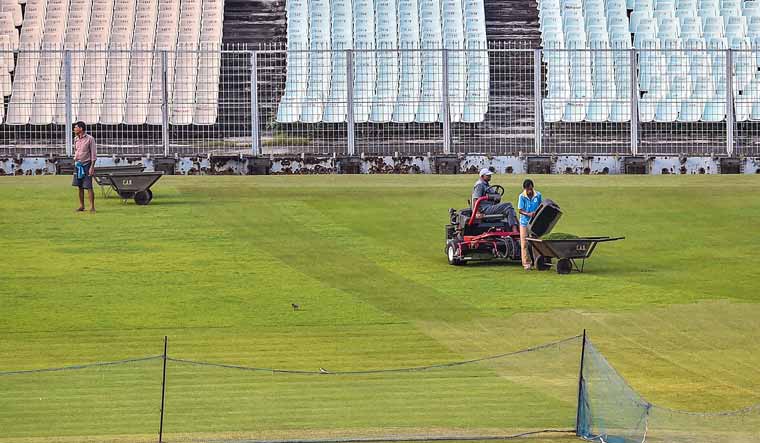 Groundsmen busy at work at Eden Garden as part of preparations to host the upcoming India-Bangladesh Day-Night Test match in Kolkata | PTI