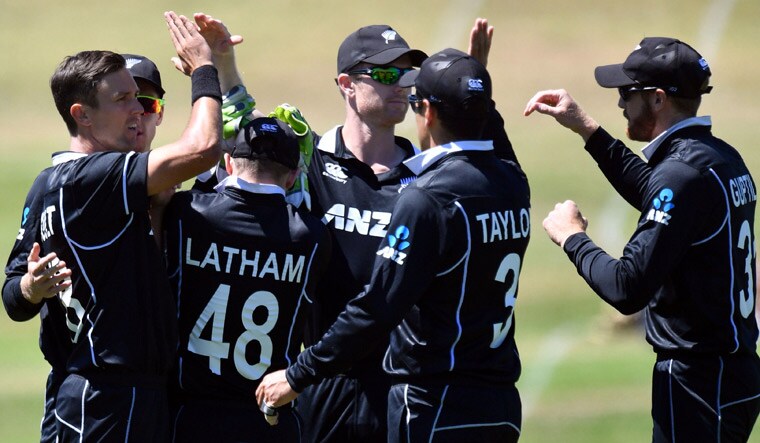 New Zealand players celebrate the wicket of Bangladesh's Tamim Iqbal | AFP