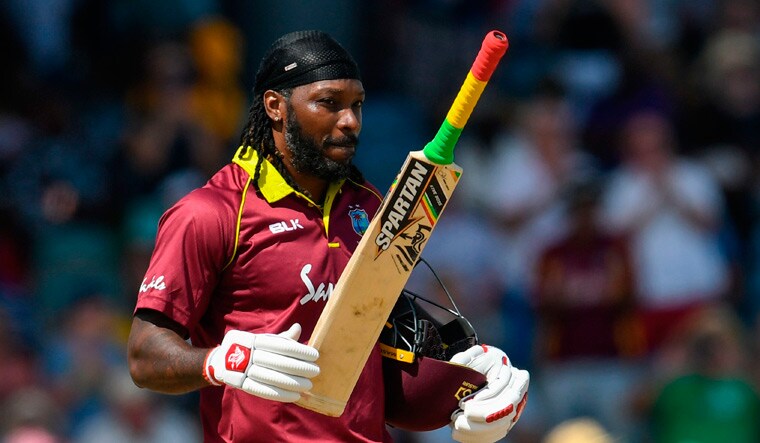 Chris Gayle celebrates his century during the first ODI against England | AFP