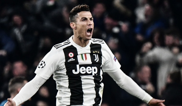 Juventus' Portuguese forward Cristiano Ronaldo celebrates after scoring his first goal against Atletico Madrid | AFP