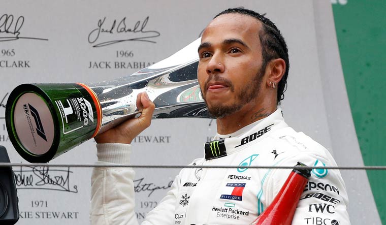 Mercedes' Lewis Hamilton celebrates winning the Chinese Grand Prix | Reuters