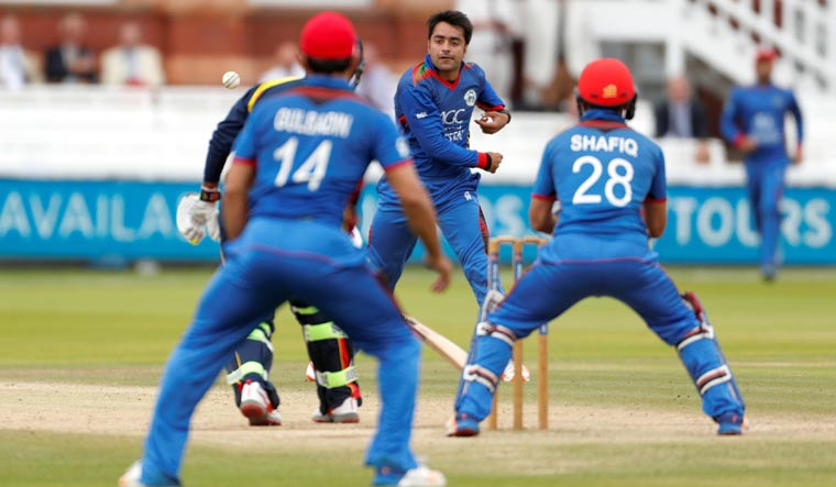 (File) Afghanistan's Rashid Khan attempts to run out MCC's Shivnarine Chanderpaul | Reuters