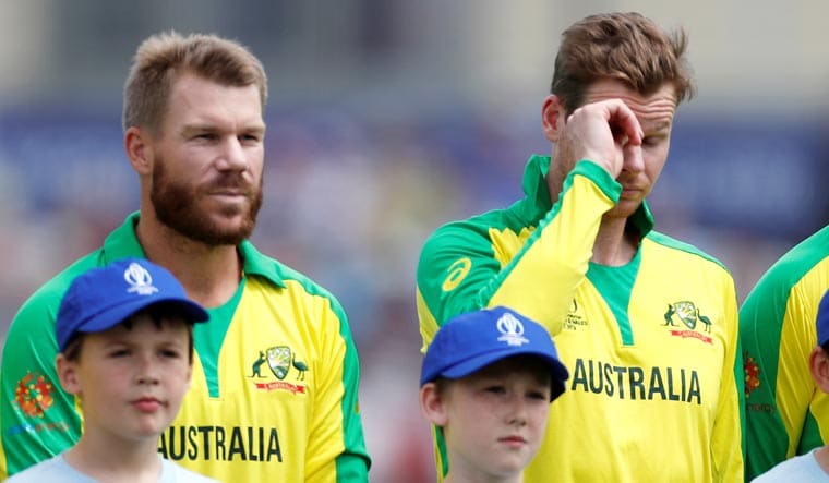 Australia's David Warner and Steve Smith during the national anthems before the start of the match against Afghanistan during the ICC World Cup 2019 at the Bristol County Ground | Reuters