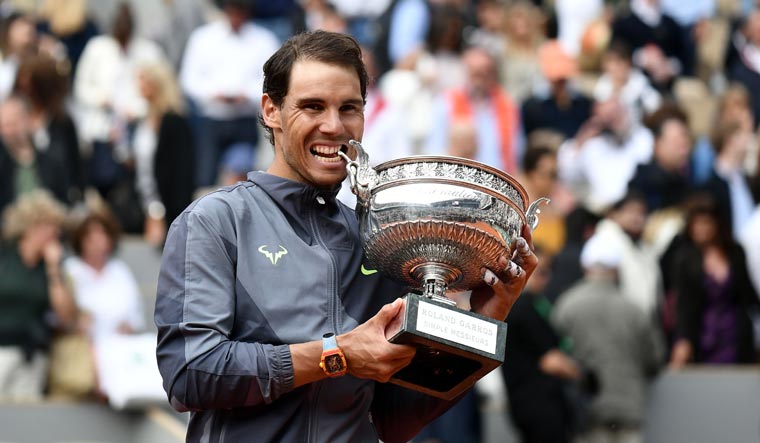 Rafael Nadal with the French Open trophy after defeating Dominic Thiem in the men's singles final | AFP