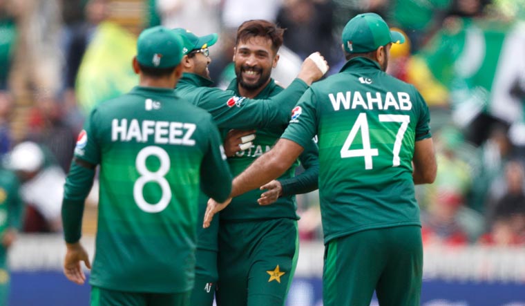 Mohammad Amir (C) celebrates after taking the wicket of Australia's Mitchell Starc during the ICC World Cup group match at Taunton | AP