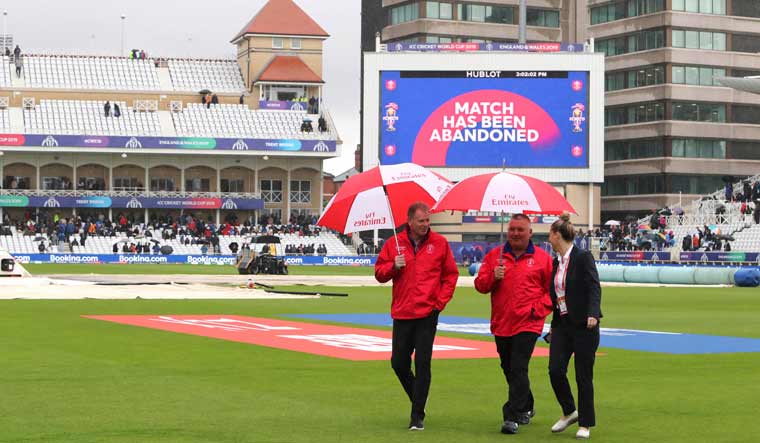 Umpires Paul Reiffel (left) with Marais Erasmus walk off the field after calling off the the ICC World Cup match between India and New Zealand at Trent Bridge in Nottingham | AP