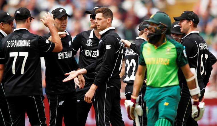 New Zealand's Mitchell Santner celebrates with teammates after taking the wicket of South Africa's Hashim Amla during the ICC World Cup group match at Edgbaston | Reuters