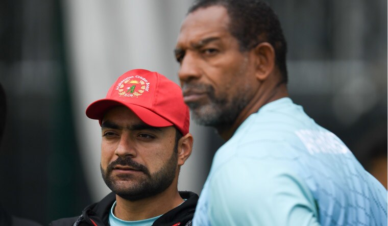 Afghanistan's Rashid Khan (left) and head coach Phil Simmons during a training session in Manchester | AFP