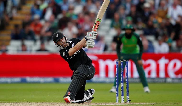 New Zealand's Kane Williamson scores a six to reach his century during the World Cup match against South Africa | AFP