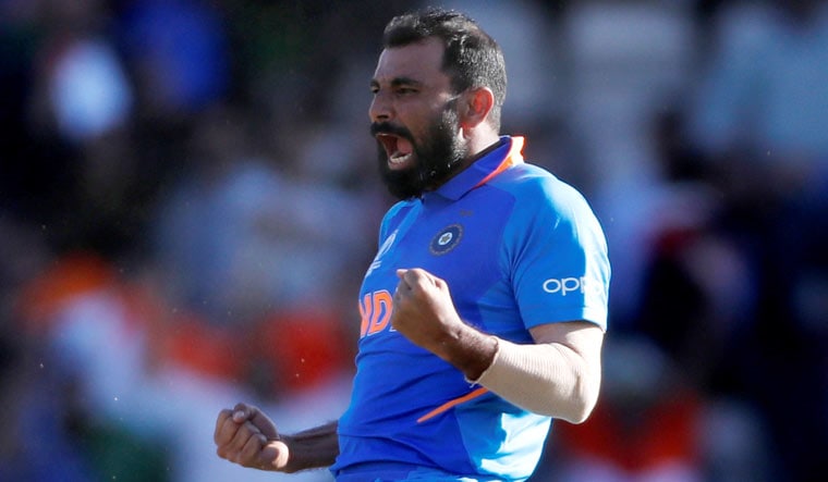 Mohammad Shami celebrates taking the wicket of Afghanistan's Mujeeb Ur Rahman to complete a hat-trick and win the group stage match at the ICC World Cup, in Southampton | Reuters