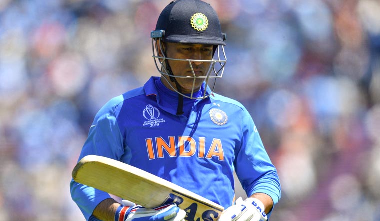M.S. Dhoni walks back to the pavilion after his dismissal during the 2019 World Cup group stage match between India and Afghanistan at the Rose Bowl in Southampton | AFP