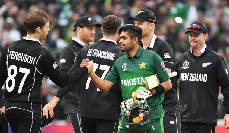 Pakistan's Babar Azam shakes hands with New Zealand's Lockie Ferguson (left) after their World Cup match at Edgbaston | AFP