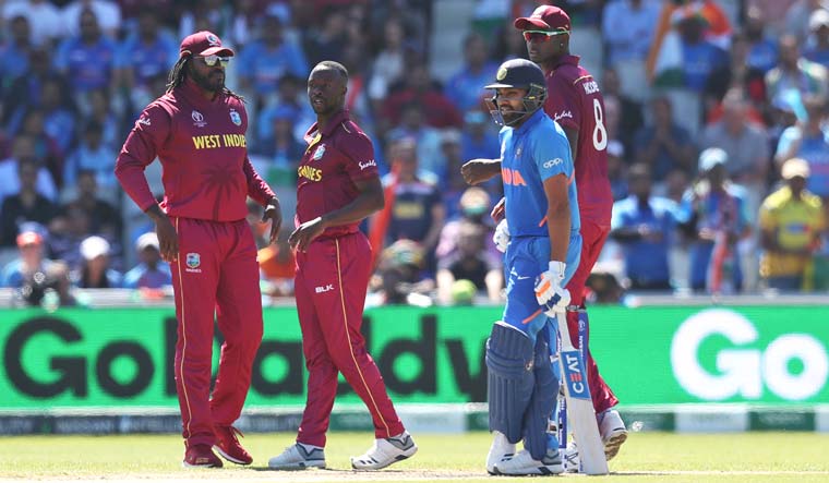 Rohit Sharma reacts after being dismissed by Kemar Roach during the World Cup group match against the West Indies at Old Trafford in Manchester | AP