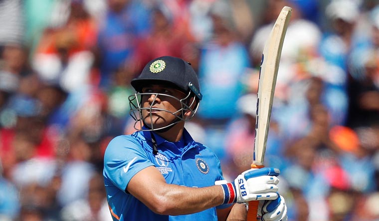 Mahendra Singh Dhoni plays a shot during the World Cup match against West Indies | Reuters