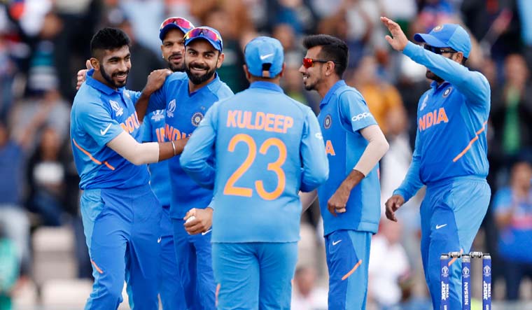 India captain Virat Kohli (second left) celebrates after taking a catch to dismiss South Africa's Quinton de Kock off the bowling of Jasprit Bumrah, during their World Cup match at the Hampshire Bowl in Southampton | AP