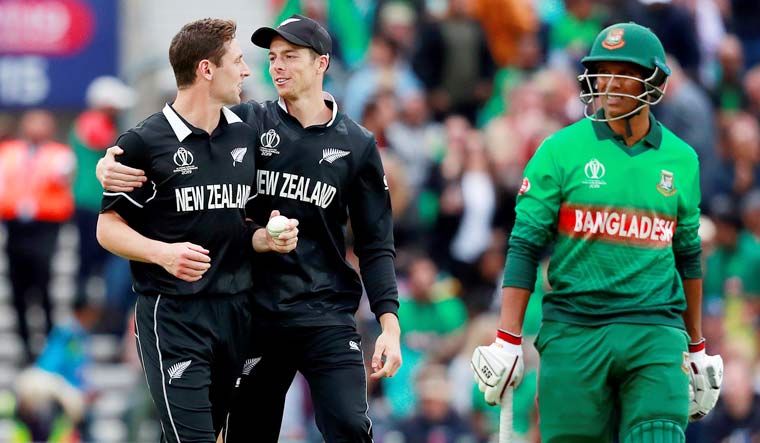 New Zealand's Matt Henry (left) celebrates after taking the wicket of Bangladesh's Mohammad Saifuddin during the ICC World Cup 2019 group match at The Oval in London | Reuters