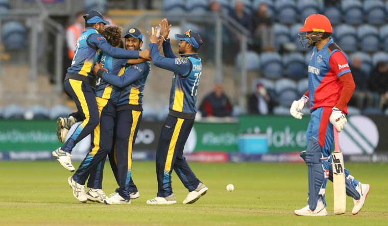 Sri Lanka celebrate their victory over Afghanistan, in the ICC World Cup group stage at the Cardiff Stadium, Wales | AP