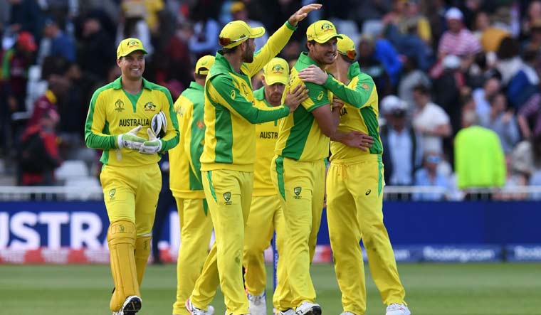 Australia's Mitchell Starc (second from right) is congratulated by teammates after taking five wickets | AFP