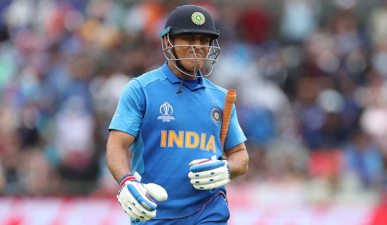 Dhoni reacts as he leaves the field after being dismissed during the World Cup semifinal between India and New Zealand at Old Trafford in Manchester | AP